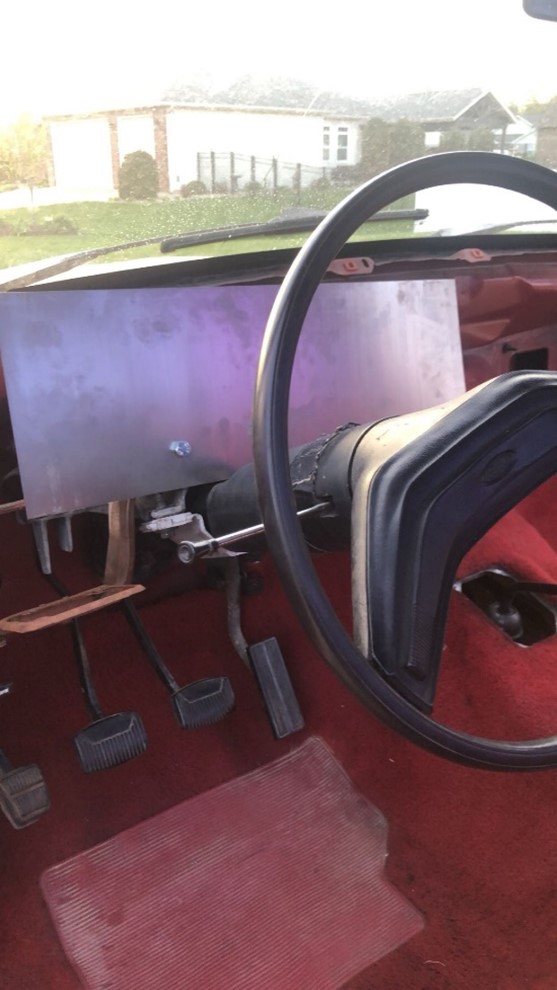 Aluminum dashboard panel installed in the truck interior before finishing